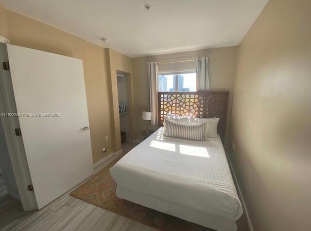 481 NE 29th St Unit 706, Miami, FL 33137 - bedroom featuring wood finished floors and baseboards