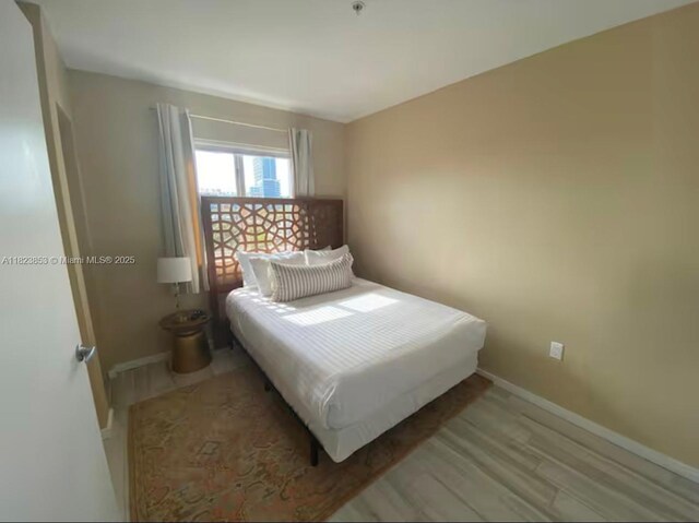 481 NE 29th St Unit 706, Miami, FL 33137 - bedroom with wood finished floors and baseboards