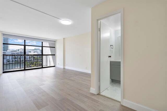 600 Parkview Dr Unit 624, Hallandale Beach, FL 33009 - unfurnished room featuring wood finished floors and baseboards