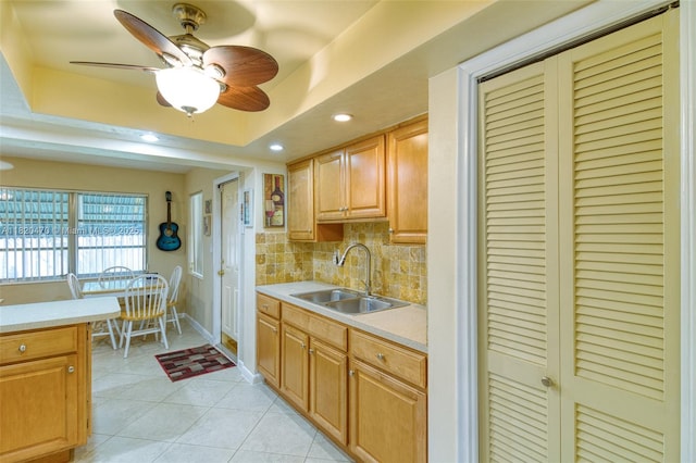 6530 NW 29th St, Sunrise, FL 33313 - kitchen featuring light countertops, ceiling fan, tasteful backsplash, a raised ceiling, and recessed lighting