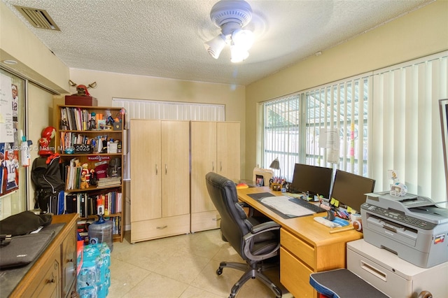 6530 NW 29th St, Sunrise, FL 33313 - home office with a textured ceiling, light tile patterned floors, and a ceiling fan