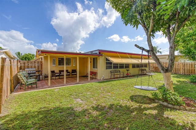 6530 NW 29th St, Sunrise, FL 33313 - rear view of house with a fenced backyard, a patio, and stucco siding