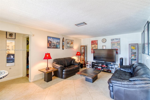 6530 NW 29th St, Sunrise, FL 33313 - living room featuring light tile patterned floors and a textured ceiling