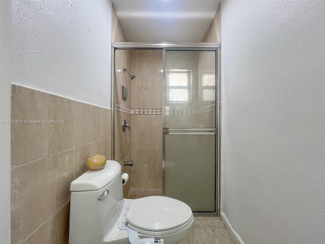 6530 NW 29th St, Sunrise, FL 33313 - full bathroom with tile walls, a shower stall, and a textured wall
