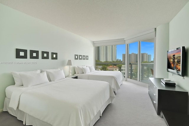 16400 Collins Ave Unit 544, Sunny Isles Beach, FL 33160 - bedroom with light carpet and access to exterior
