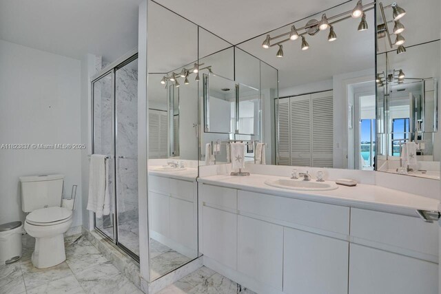 16400 Collins Ave Unit 544, Sunny Isles Beach, FL 33160 - full bath featuring marble look tile flooring, a closet, double vanity, and a stall shower