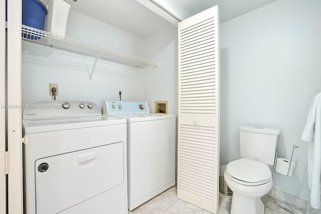 16400 Collins Ave Unit 544, Sunny Isles Beach, FL 33160 - laundry room with light marble finish flooring and independent washer and dryer