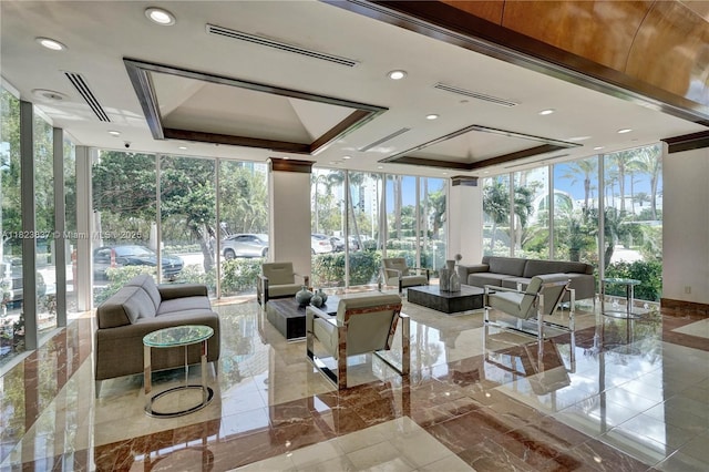 16400 Collins Ave Unit 544, Sunny Isles Beach, FL 33160 - sunroom with expansive windows, healthy amount of natural light, marble tiled floors, and a tray ceiling
