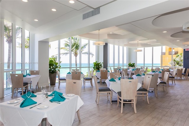 16400 Collins Ave Unit 544, Sunny Isles Beach, FL 33160 - dining space with light wood-style floors, healthy amount of natural light, and floor to ceiling windows