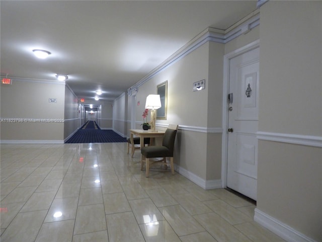 5005 Collins Ave Unit 202, Miami Beach, FL 33140 - hallway with ornamental molding and light tile patterned flooring