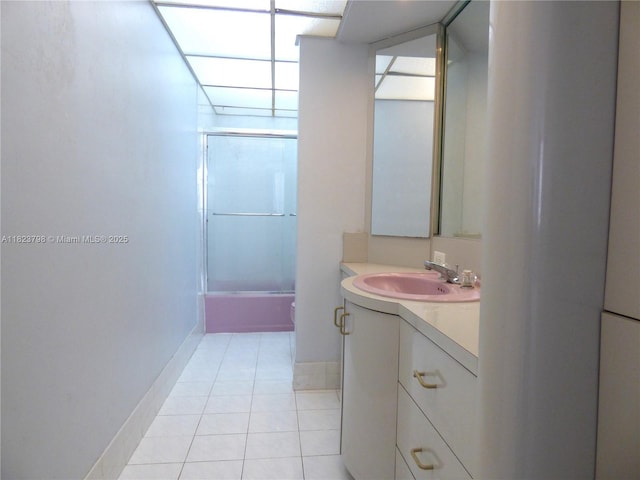 5005 Collins Ave Unit 202, Miami Beach, FL 33140 - bathroom with vanity, bath / shower combo with glass door, and tile patterned flooring