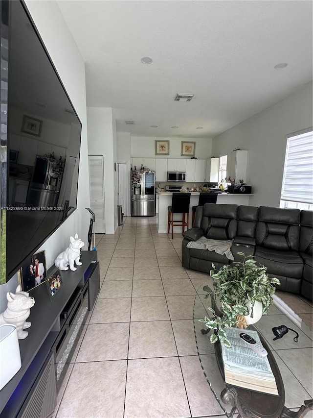 9860 SW 161st Ave, Miami, FL 33196 - living room with healthy amount of natural light and light tile patterned floors