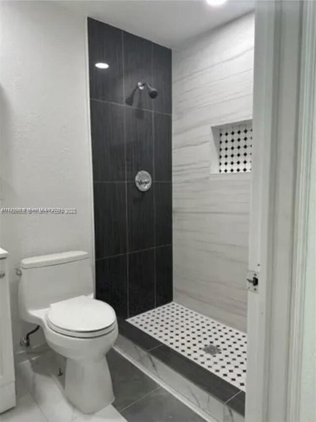 9860 SW 161st Ave, Miami, FL 33196 - full bathroom featuring a stall shower, marble look tile flooring, and vanity