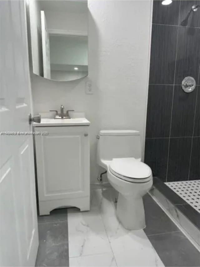 9860 SW 161st Ave, Miami, FL 33196 - bathroom with tiled shower, vanity, and marble finish flooring