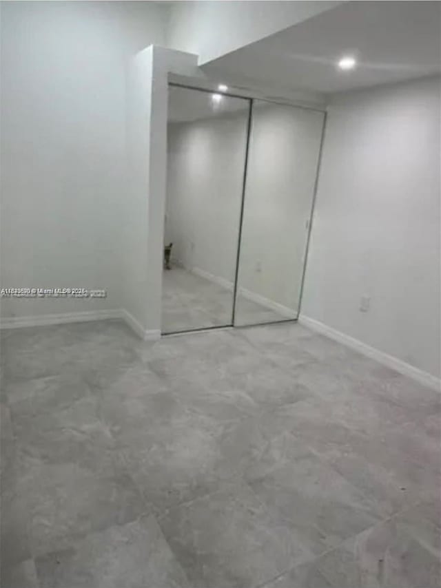 9860 SW 161st Ave, Miami, FL 33196 - unfurnished bedroom featuring baseboards and a closet