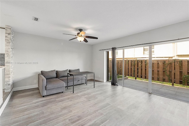 8239 NW 8th St Unit 3, Plantation, FL 33324 - living area with light wood-type flooring and a ceiling fan