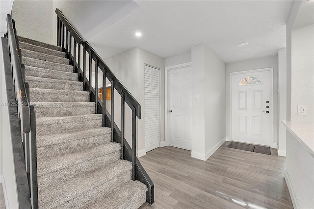 8239 NW 8th St Unit 3, Plantation, FL 33324 - entrance foyer featuring stairway, light wood-style flooring, and recessed lighting
