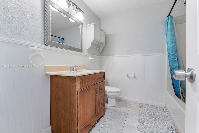 8239 NW 8th St Unit 3, Plantation, FL 33324 - bathroom featuring wainscoting, vanity, tile patterned floors, and shower / bathtub combination with curtain
