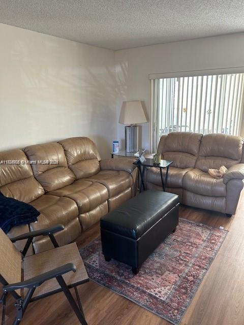 13648 Coconut Palm Ct Unit C, Delray Beach, FL 33484 - living area with a textured ceiling and wood finished floors