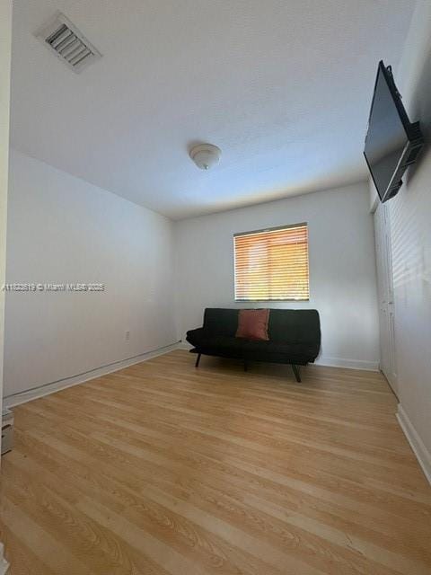 13933 SW 155th Ct, Miami, FL 33196 - sitting room featuring light wood-style floors and baseboards