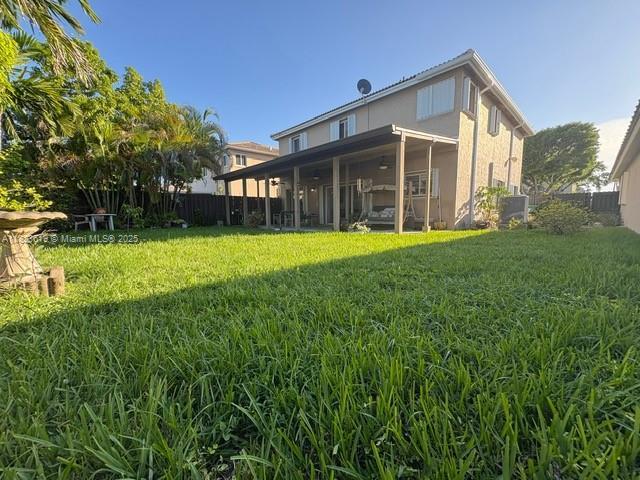 13933 SW 155th Ct, Miami, FL 33196 - rear view of property with stucco siding