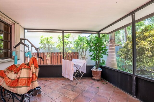 9064 Garland Ave, Surfside, FL 33154 - sunroom featuring tile patterned floors