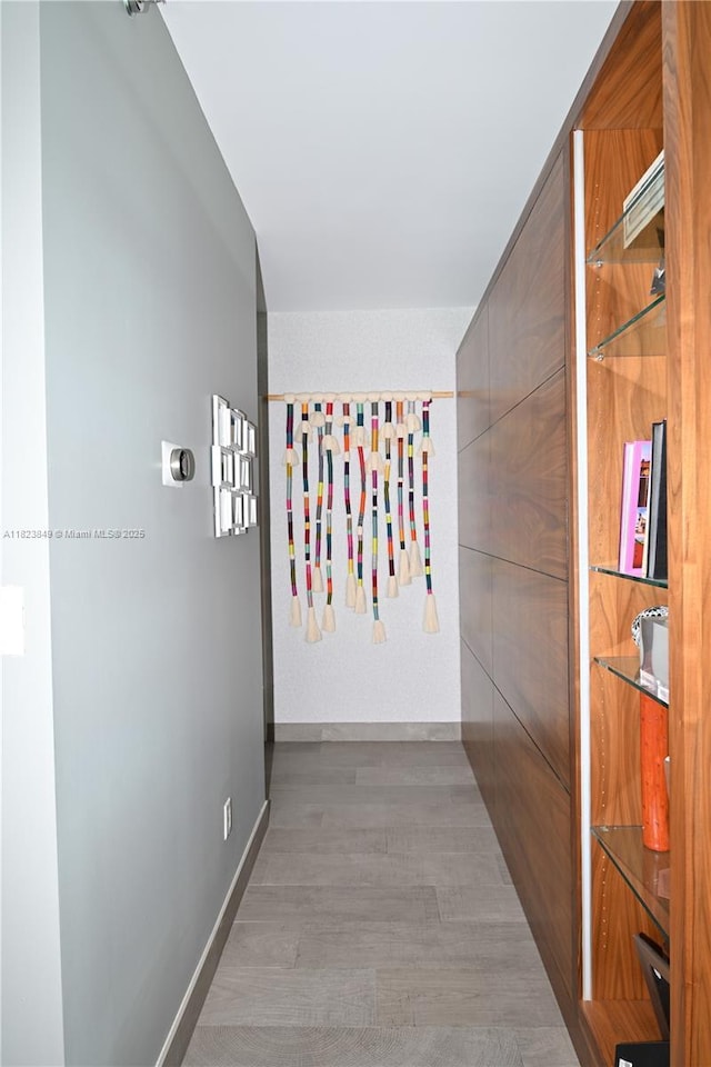 2127 Brickell Ave Unit 1005, Miami, FL 33129 - corridor featuring wood finished floors and baseboards