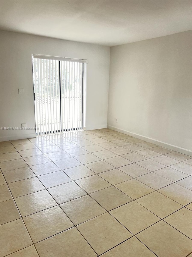 4017 NW 87th Ave Unit 4017, Sunrise, FL 33351 - unfurnished room with light tile patterned floors and baseboards