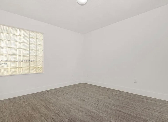 9720 SW 154th Pl, Miami, FL 33196 - unfurnished room featuring wood finished floors and baseboards