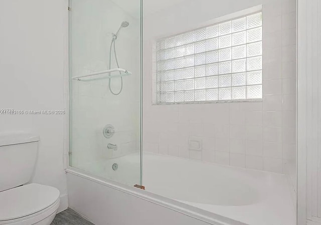9720 SW 154th Pl, Miami, FL 33196 - bathroom featuring toilet and bath / shower combo with glass door