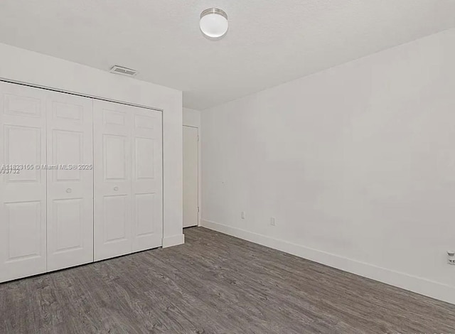 9720 SW 154th Pl, Miami, FL 33196 - unfurnished bedroom with wood finished floors and a closet