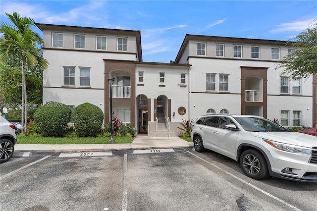 4445 SW 160th Ave Unit 102, Miramar, FL 33027 - townhome / multi-family property with stucco siding and uncovered parking