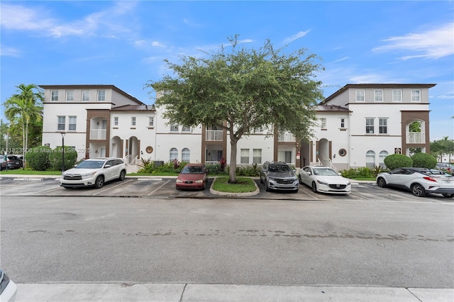 4445 SW 160th Ave Unit 102, Miramar, FL 33027 - townhome / multi-family property featuring uncovered parking and stucco siding