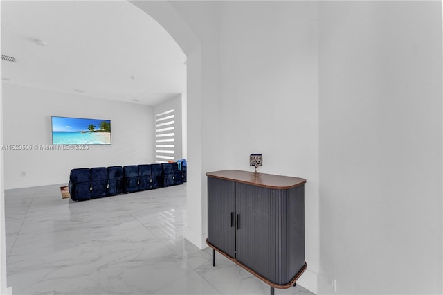 4445 SW 160th Ave Unit 102, Miramar, FL 33027 - hall with arched walkways and marble look tile flooring