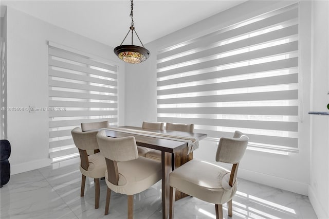 4445 SW 160th Ave Unit 102, Miramar, FL 33027 - dining area featuring light marble finish floors and baseboards
