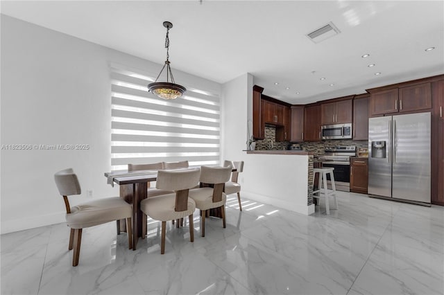4445 SW 160th Ave Unit 102, Miramar, FL 33027 - dining space featuring light marble finish floors and recessed lighting