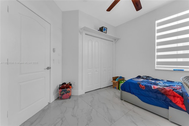 4445 SW 160th Ave Unit 102, Miramar, FL 33027 - bedroom with marble finish floors, a closet, and a ceiling fan