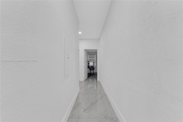 4445 SW 160th Ave Unit 102, Miramar, FL 33027 - hall featuring light marble finish flooring, recessed lighting, and a textured wall