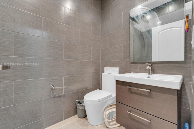 4445 SW 160th Ave Unit 102, Miramar, FL 33027 - bathroom featuring tile walls and vanity