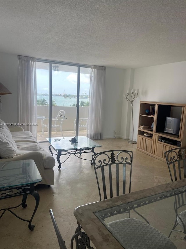 5 Island Ave Unit 5G, Miami Beach, FL 33139 - living area featuring a textured ceiling