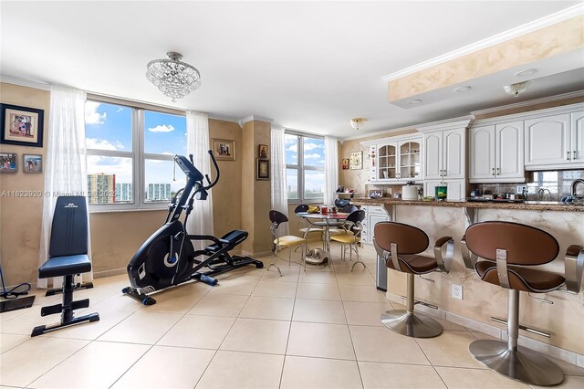 250 174th St Unit 1704, Sunny Isles Beach, FL 33160 - workout room with ornamental molding and baseboards