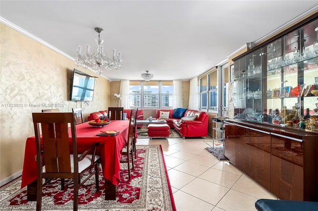 250 174th St Unit 1704, Sunny Isles Beach, FL 33160 - dining space featuring a chandelier, crown molding, and light tile patterned flooring