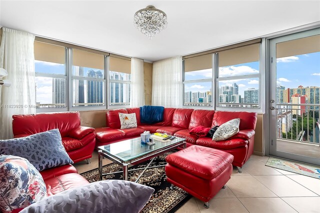 250 174th St Unit 1704, Sunny Isles Beach, FL 33160 - tiled living room featuring a view of city and plenty of natural light