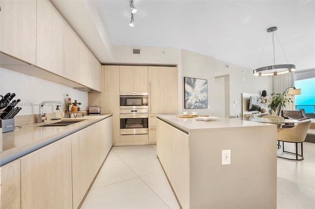 4111 S Ocean Dr Unit 3709, Hollywood, FL 33019 - kitchen featuring light brown cabinetry, stainless steel double oven, light tile patterned floors, light countertops, and a kitchen island