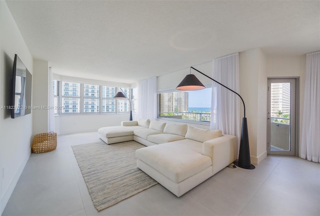 1965 S Ocean Dr Unit 6F, Hallandale Beach, FL 33009 - living room with baseboards and tile patterned flooring