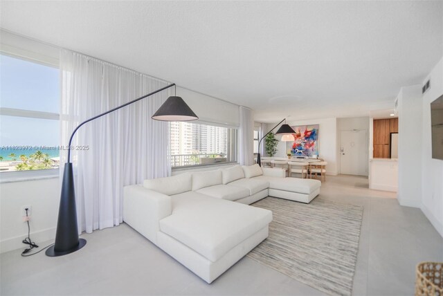 1965 S Ocean Dr Unit 6F, Hallandale Beach, FL 33009 - living room featuring baseboards