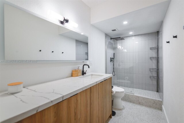 1965 S Ocean Dr Unit 6F, Hallandale Beach, FL 33009 - bathroom featuring vanity, tiled shower, speckled floor, and recessed lighting