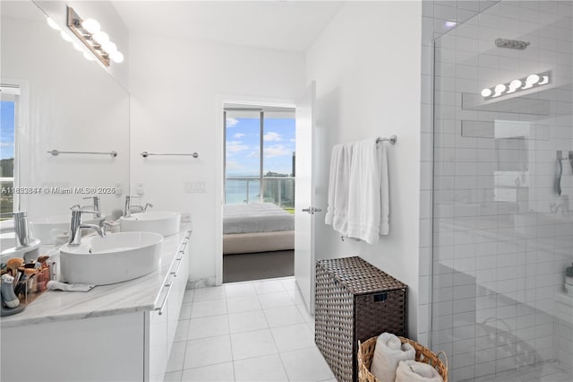 888 Biscayne Blvd Unit 4801, Miami, FL 33132 - ensuite bathroom with double vanity, a tile shower, and tile patterned flooring