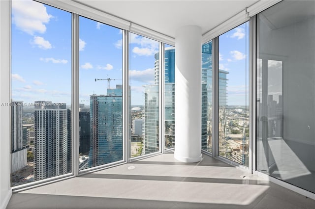 888 Biscayne Blvd Unit 4801, Miami, FL 33132 - empty room featuring a wall of windows, a city view, and healthy amount of natural light
