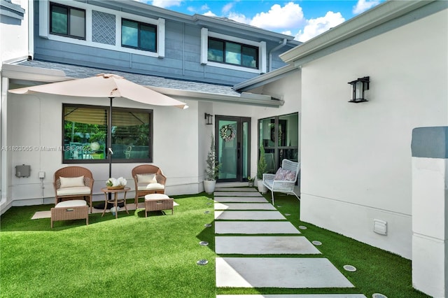 9905 NW 52nd Ln, Doral, FL 33178 - rear view of property featuring a shingled roof, a lawn, and stucco siding
